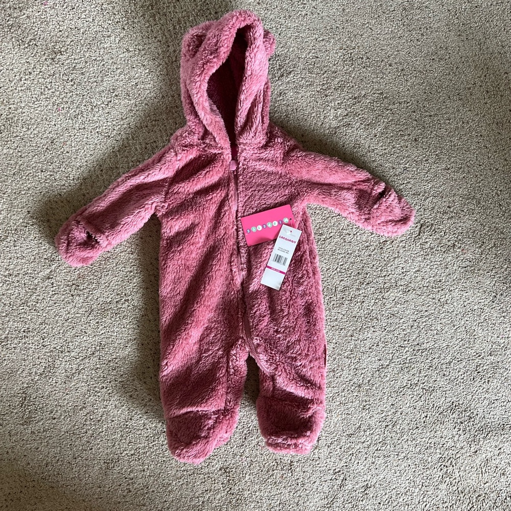 Fuzzy pink zip up one piece with hood. Brand new with tags! 3-6 months.